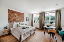 Mainterrasse Panorama Apartments - Bett im Apartment MainAnker